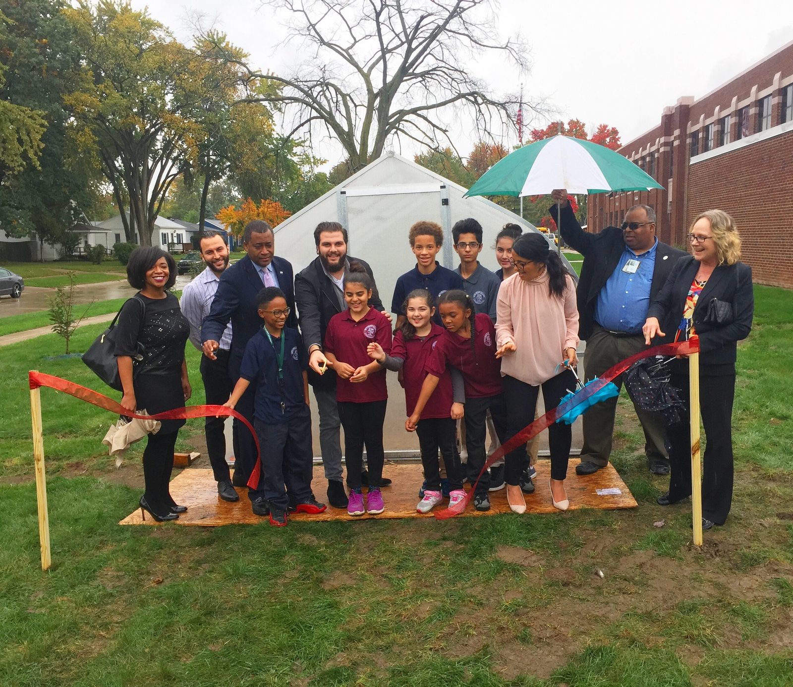 A group of students gathered for the ribbon-cutting ceremony of a new school garden installed by KEYS