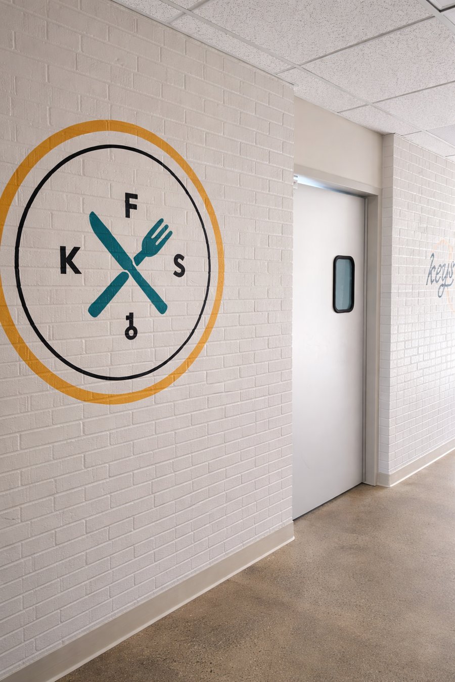 KEYS Food Service emblem painted on the wall of a Michigan commissary kitchen